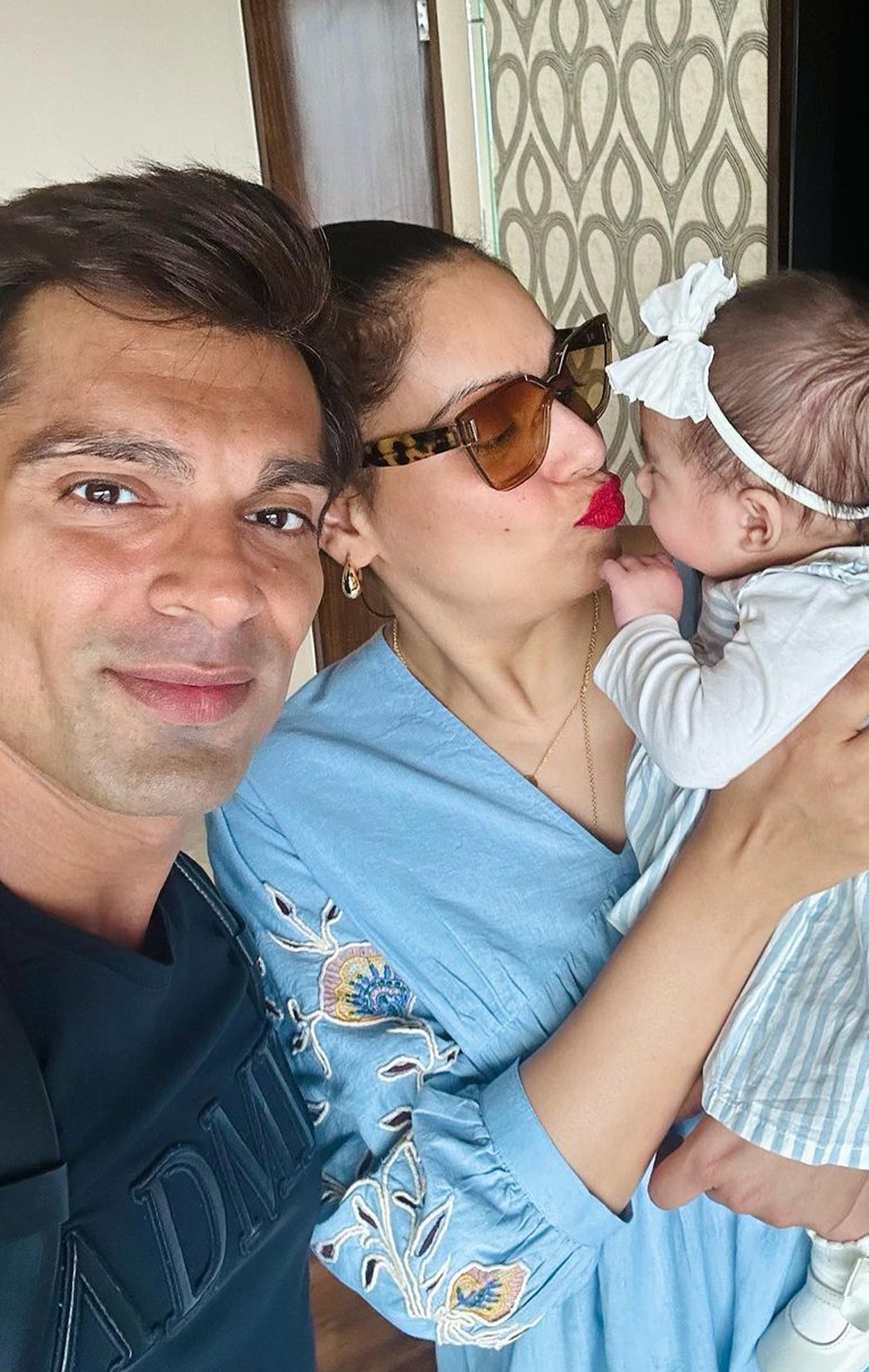 Daddy Karan has a twinkle in his eyes as he adores Bipasha and Devi